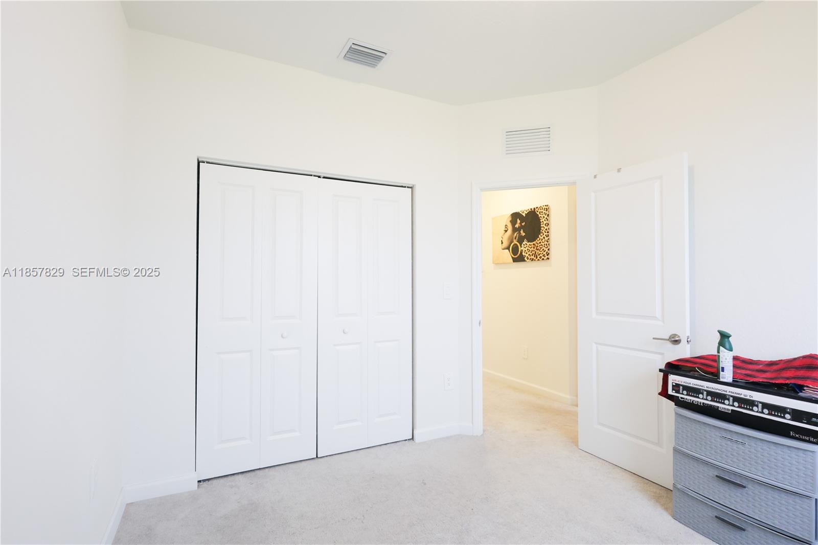 14824 Southwest 265th Street Homestead, FL 33032 - Photo 15 of 17 a view of a room with storage and utility