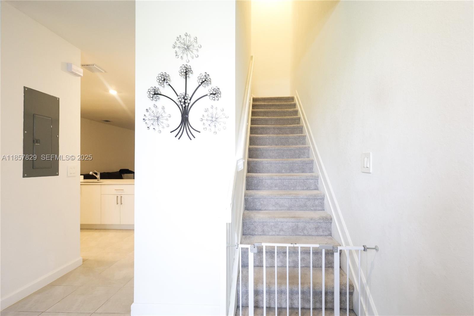 14824 Southwest 265th Street Homestead, FL 33032 - Photo 2 of 17 a view of a hallway with wooden floor and staircase