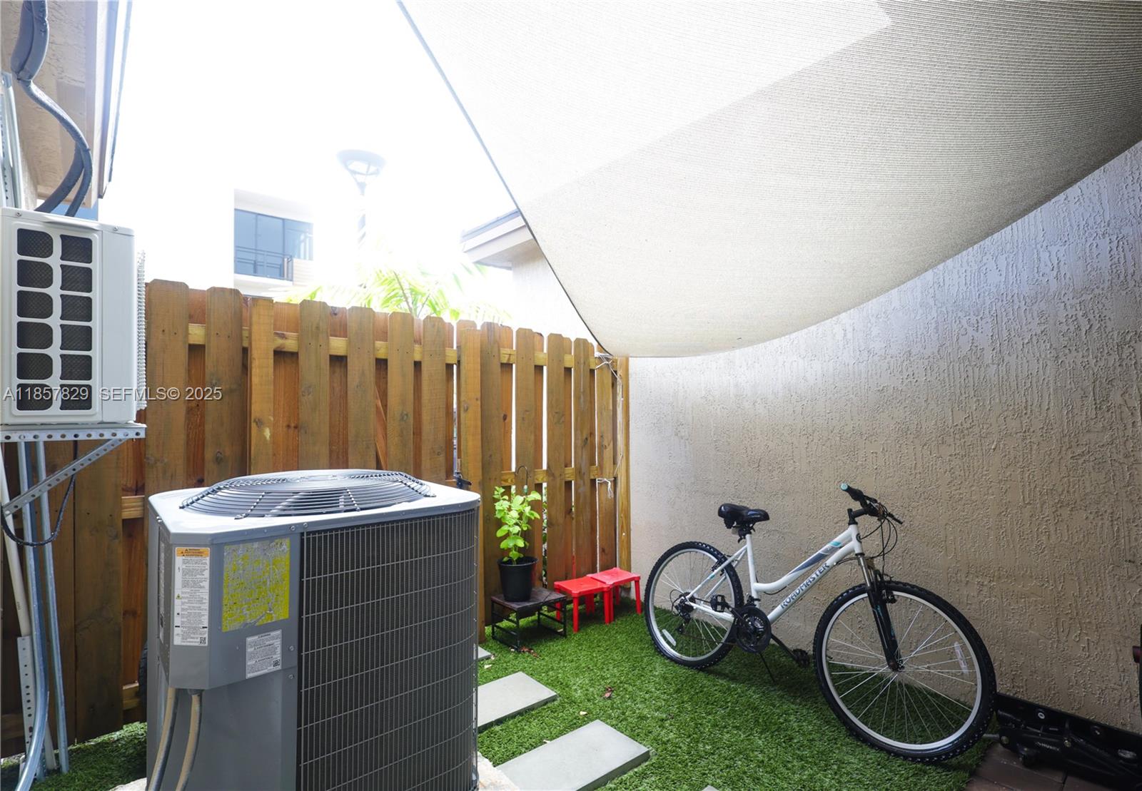 14824 Southwest 265th Street Homestead, FL 33032 - Photo 8 of 17 a backyard with table and chairs