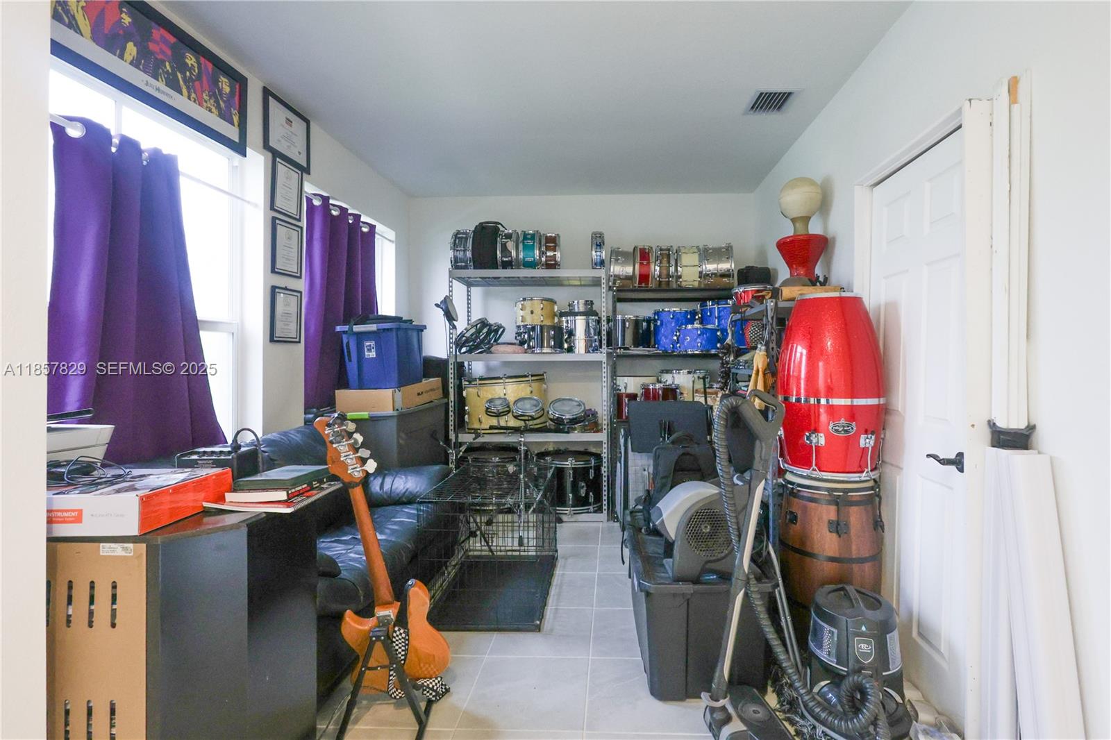 14824 Southwest 265th Street Homestead, FL 33032 - Photo 9 of 17 a room with furniture a rug and a chair