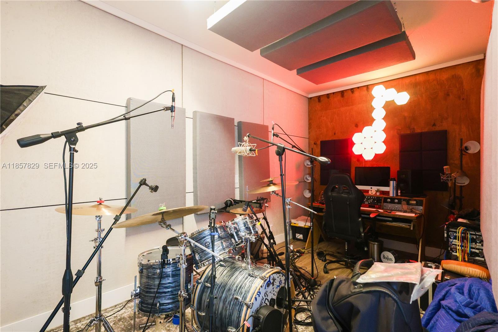 14824 Southwest 265th Street Homestead, FL 33032 - Photo 10 of 17 a view of walk in closet with clothes and shoes