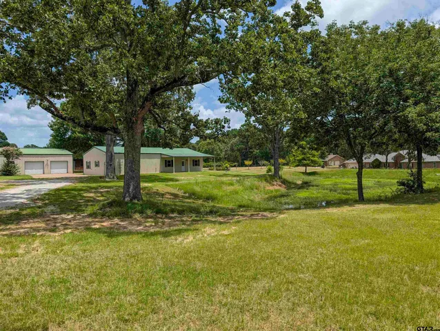 a view of a house with a big yard