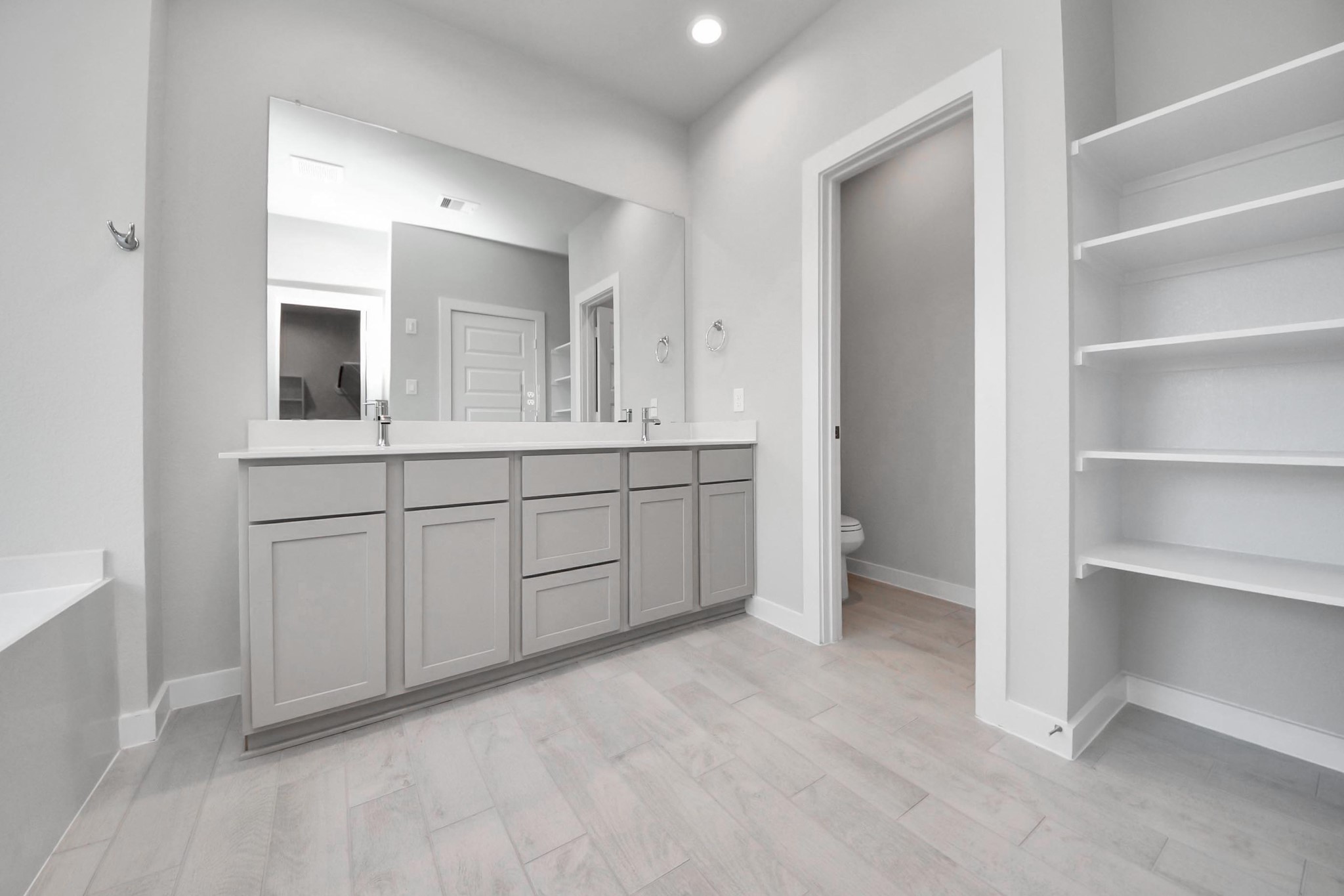 15715 Telge Ridge Lane Cypress, TX 77429 - Photo 28 of 48 a bathroom with a double vanity sink and mirror