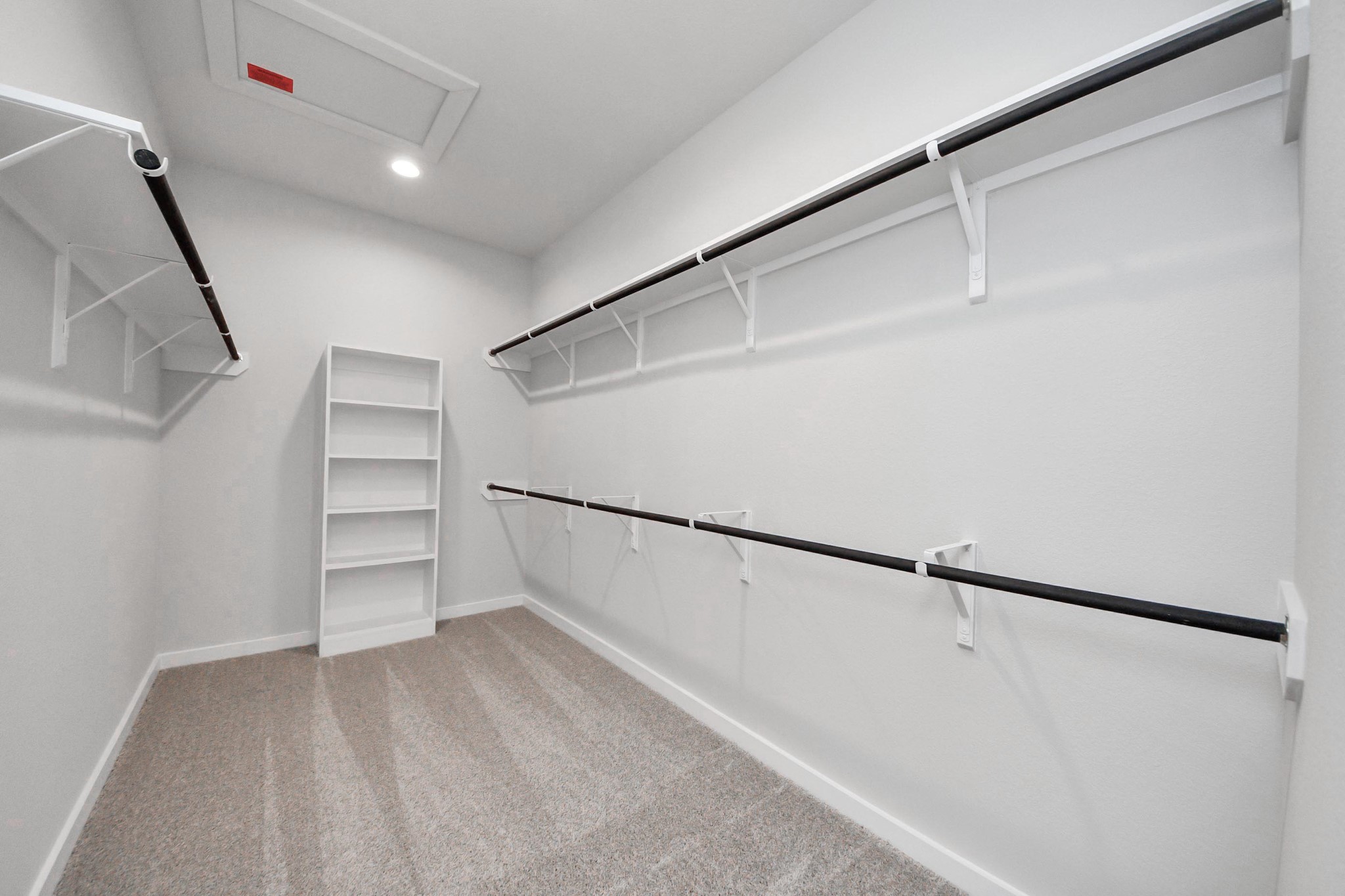 15715 Telge Ridge Lane Cypress, TX 77429 - Photo 29 of 48 a view of walk in closet with empty racks