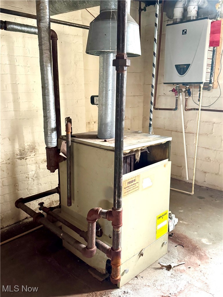 2152 Middlefield Road Cleveland, OH 44106 - Photo 41 of 50 Utility room featuring water heater