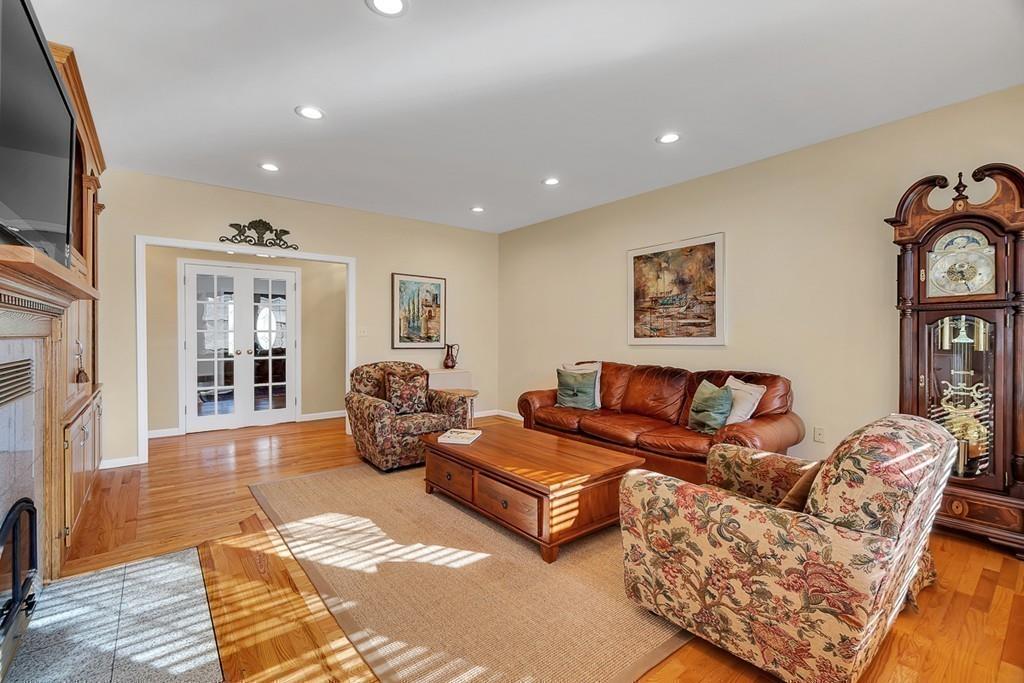 2 Sunset Rock Road Andover, MA 01810 - Photo 14 of 42 a living room with furniture large window and wooden floor