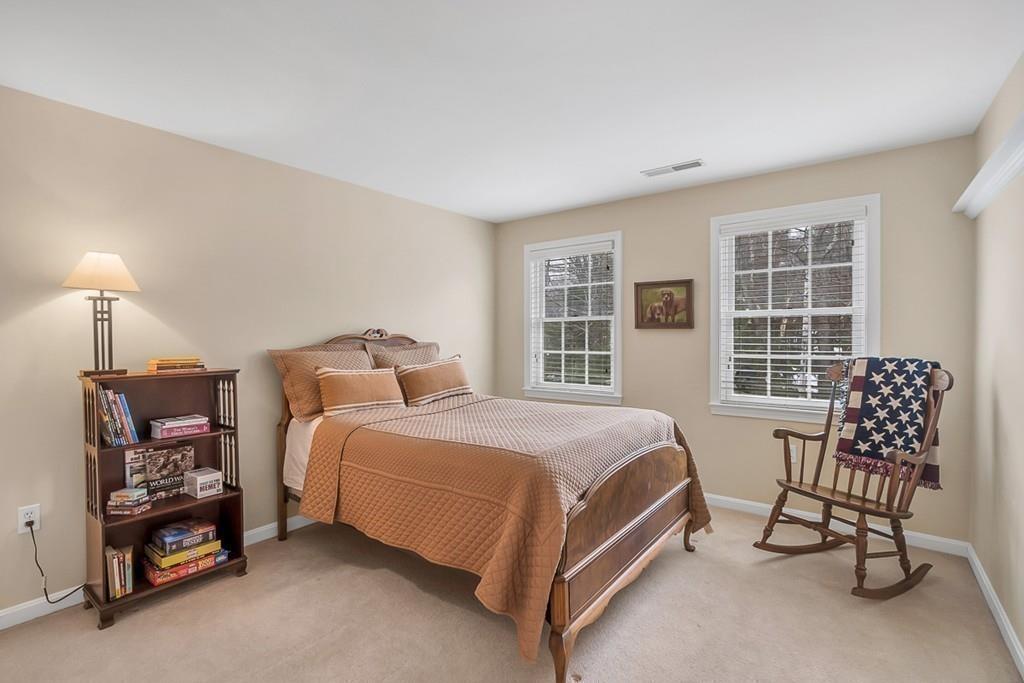 2 Sunset Rock Road Andover, MA 01810 - Photo 29 of 42 a bed room with a bed and a chair