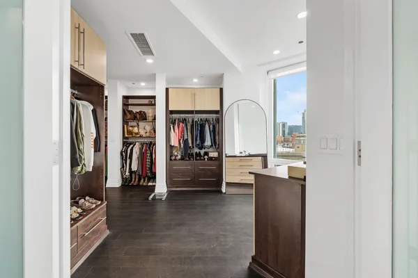 a spacious bathroom with a double vanity sink and a mirror
