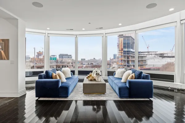 a living room with furniture and a large window