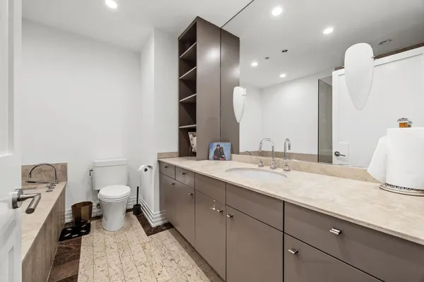 a bathroom with a sink and tub