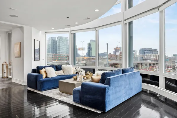 a living room with furniture and a large window