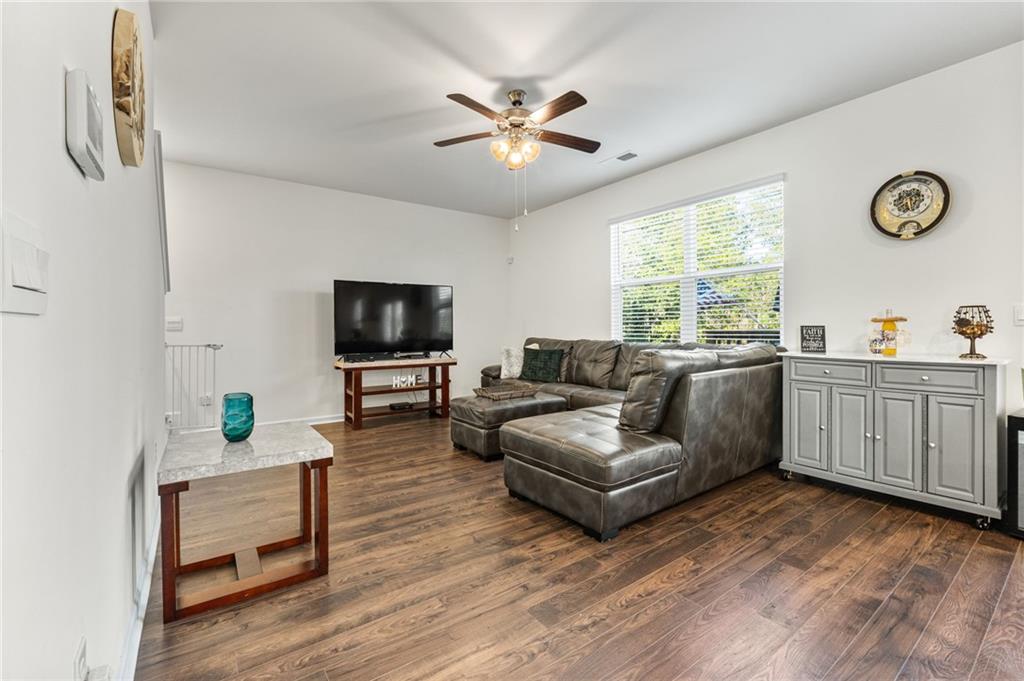 104 Waratah Drive Locust Grove, GA 30248 - Photo 5 of 27 a living room with furniture and a flat screen tv