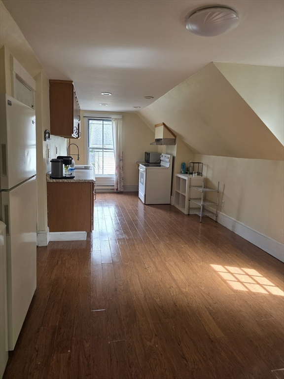 48 Maple Street, Unit 2 Holden, MA 01520 - Photo 3 of 11 a living room with furniture and a wooden floor