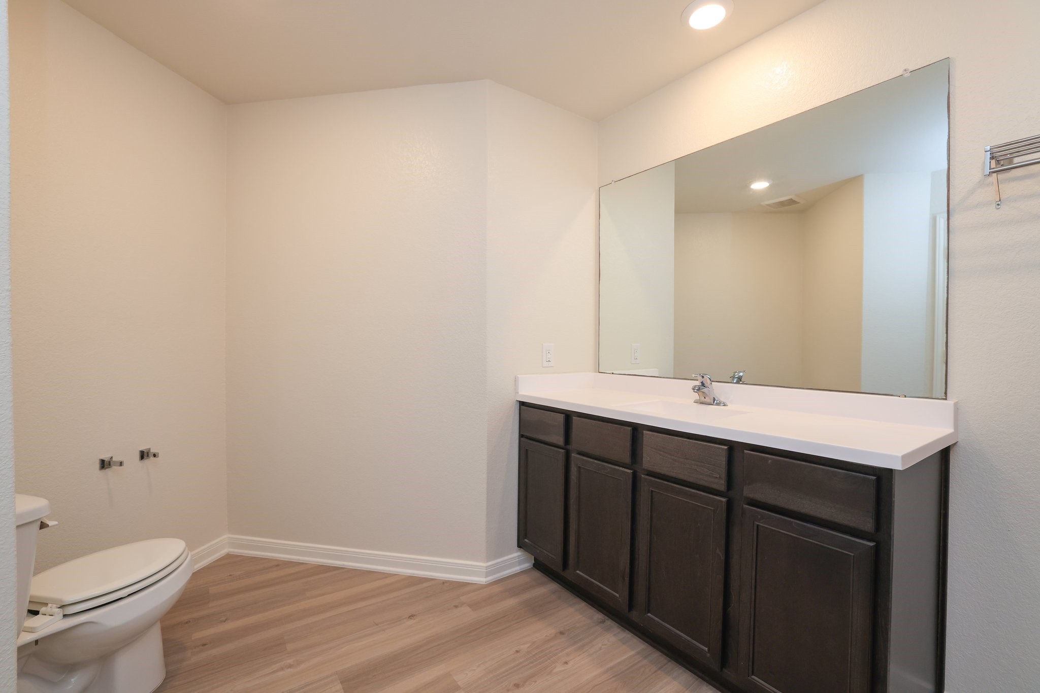 20914 Solstice Point Drive Hockley, TX 77447 - Photo 17 of 27 a bathroom with a toilet sink and mirror