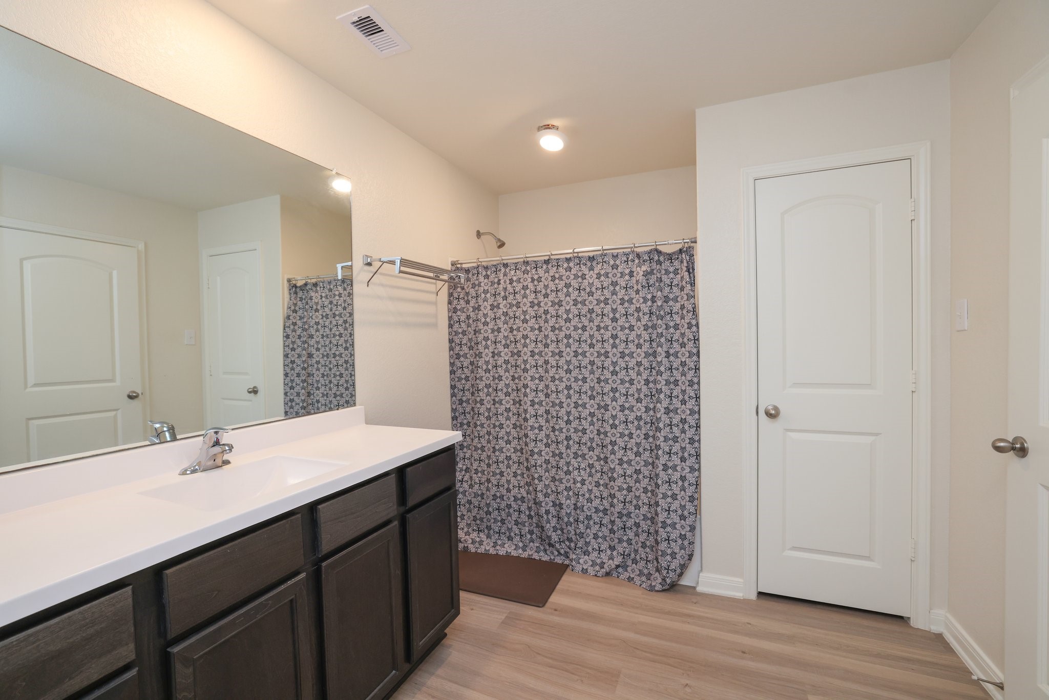 20914 Solstice Point Drive Hockley, TX 77447 - Photo 18 of 27 a bathroom with a sink a double vanity and a shower