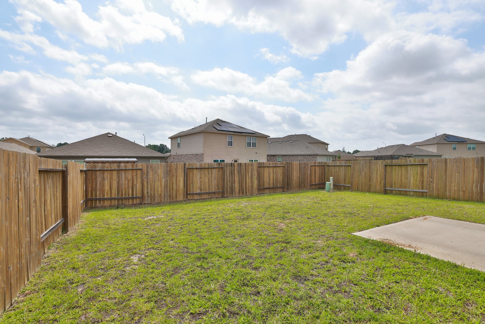20914 Solstice Point Drive Hockley, TX 77447 - Photo 25 of 27 a house view with garden space and wooden fence