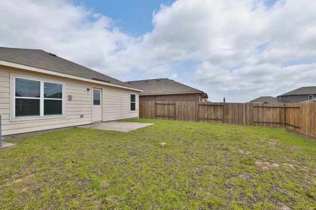a house view with swimming pool in front of it