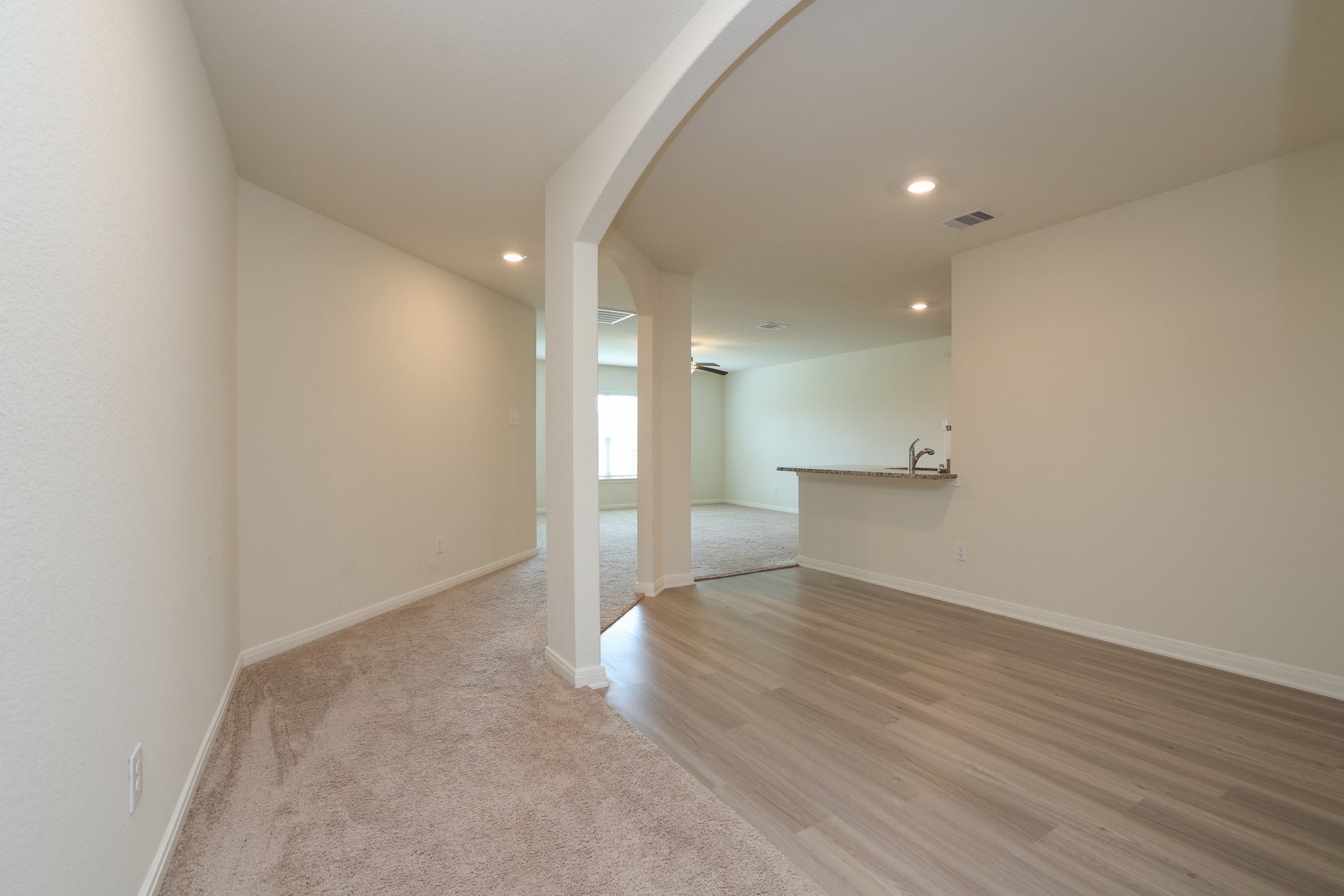 20914 Solstice Point Drive Hockley, TX 77447 - Photo 4 of 27 a view of a big room with wooden floor and windows
