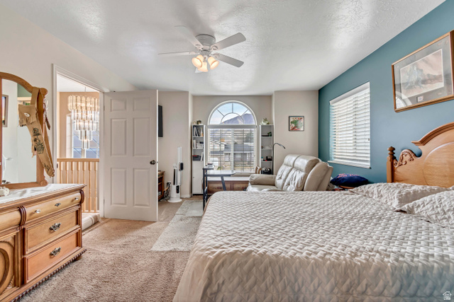 1697 North 500 West Mapleton, UT 84664 - Photo 23 of 50 Bedroom with a ceiling fan, light carpet, and a textured ceiling