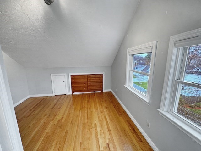 80 Delmont Avenue Worcester, MA 01604 - Photo 31 of 35 a view of an empty room with wooden floor and a window