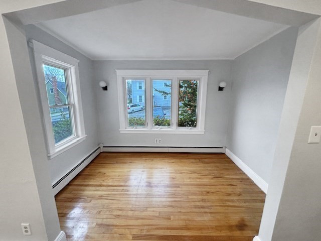 80 Delmont Avenue Worcester, MA 01604 - Photo 8 of 35 a view of an empty room with wooden floor and a window