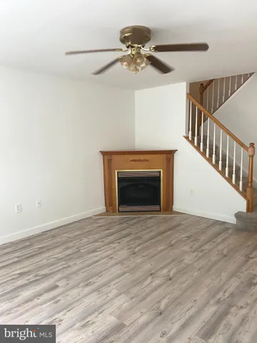a view of an empty room with a fireplace