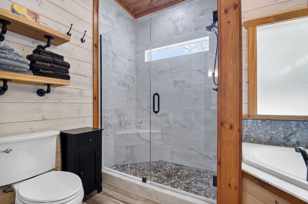 558 Tipton Springs Road Morganton, GA 30560 - Photo 14 of 66 a bathroom with a sink toilet and shower