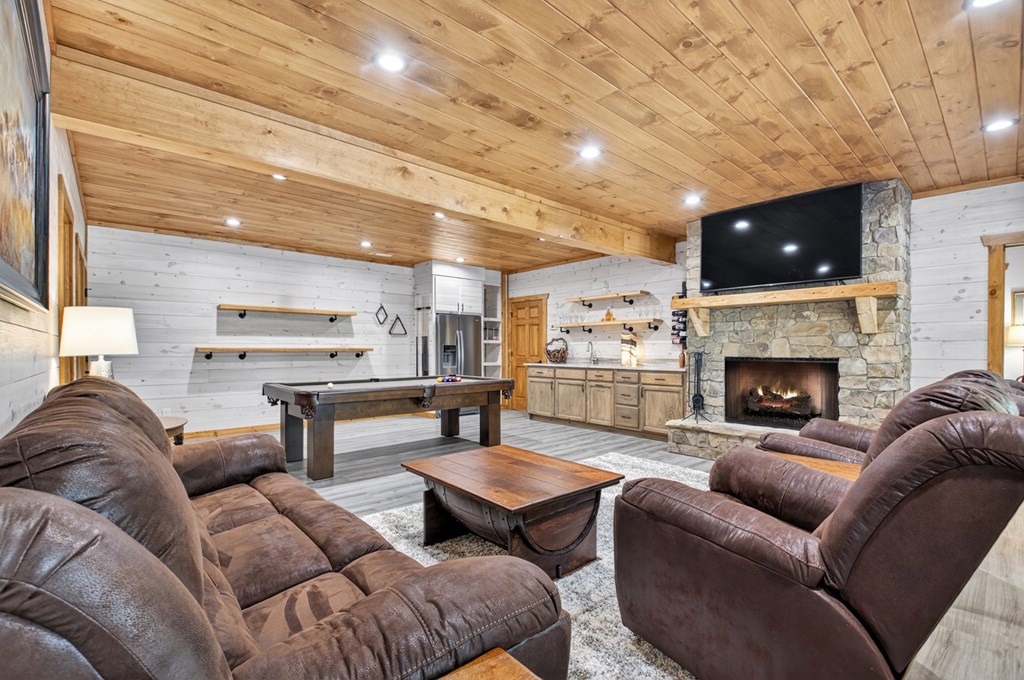 558 Tipton Springs Road Morganton, GA 30560 - Photo 25 of 66 a living room with furniture and a fireplace