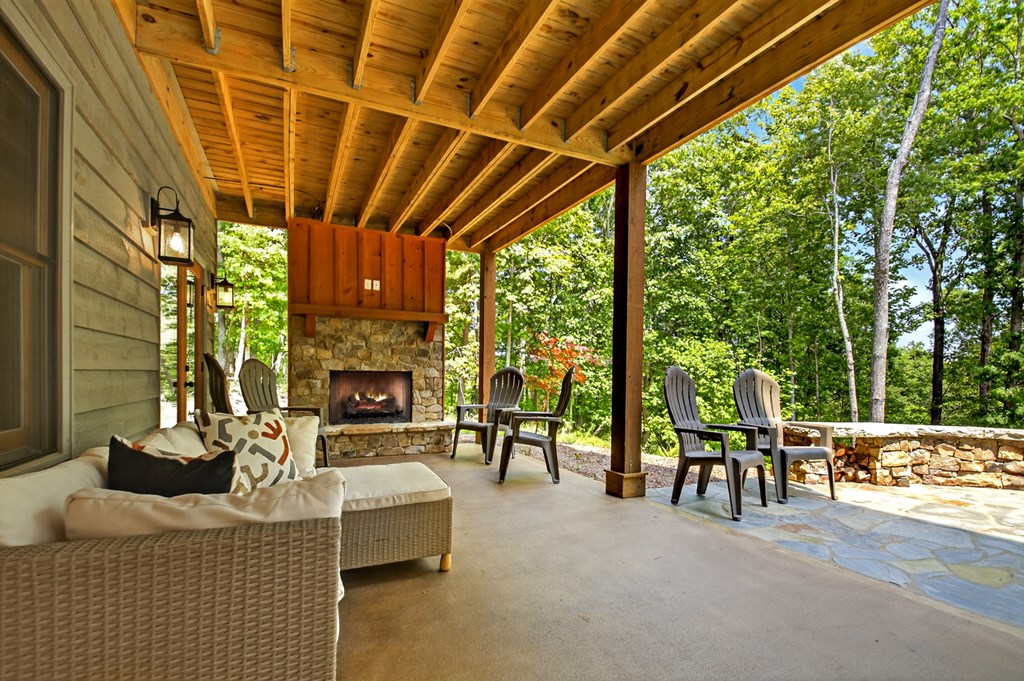 558 Tipton Springs Road Morganton, GA 30560 - Photo 35 of 66 a living room with furniture and a fireplace
