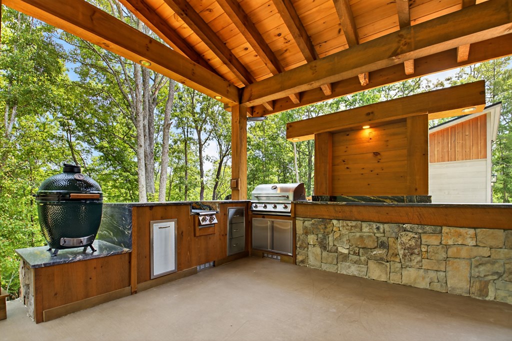 558 Tipton Springs Road Morganton, GA 30560 - Photo 37 of 66 a living room with furniture and a flat screen tv