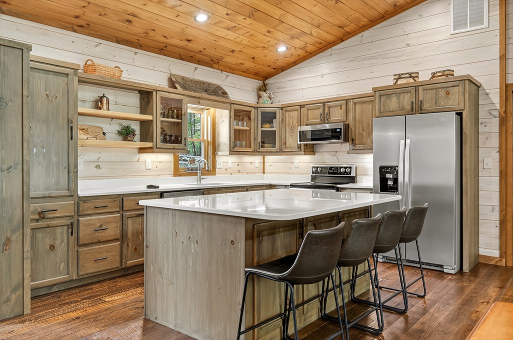 558 Tipton Springs Road Morganton, GA 30560 - Photo 4 of 66 a kitchen with stainless steel appliances granite countertop a stove refrigerator sink and cabinets