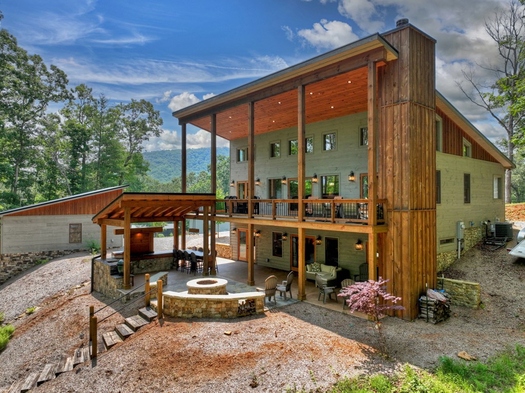 558 Tipton Springs Road Morganton, GA 30560 - Photo 47 of 66 a backyard of a house with outdoor seating