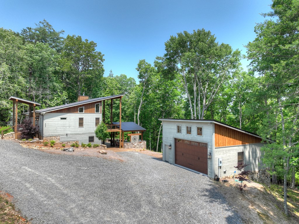 558 Tipton Springs Road Morganton, GA 30560 - Photo 48 of 66 a view of a house with backyard and trees in the background