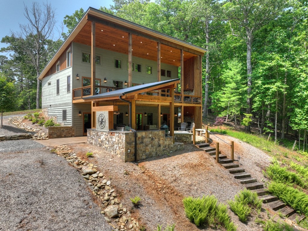 558 Tipton Springs Road Morganton, GA 30560 - Photo 56 of 66 a view of a house with backyard and sitting area