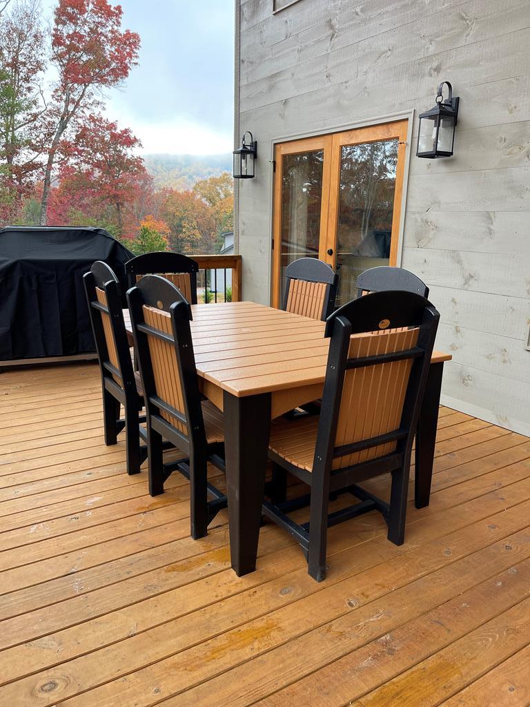 558 Tipton Springs Road Morganton, GA 30560 - Photo 61 of 66 a view of a roof deck with table and chairs with wooden floor and fence