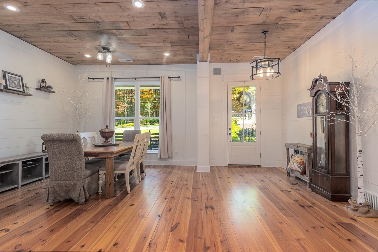 570 Wildwood Road Eads, TN 38028 - Photo 11 of 38 a view of a dining room with furniture window and wooden floor