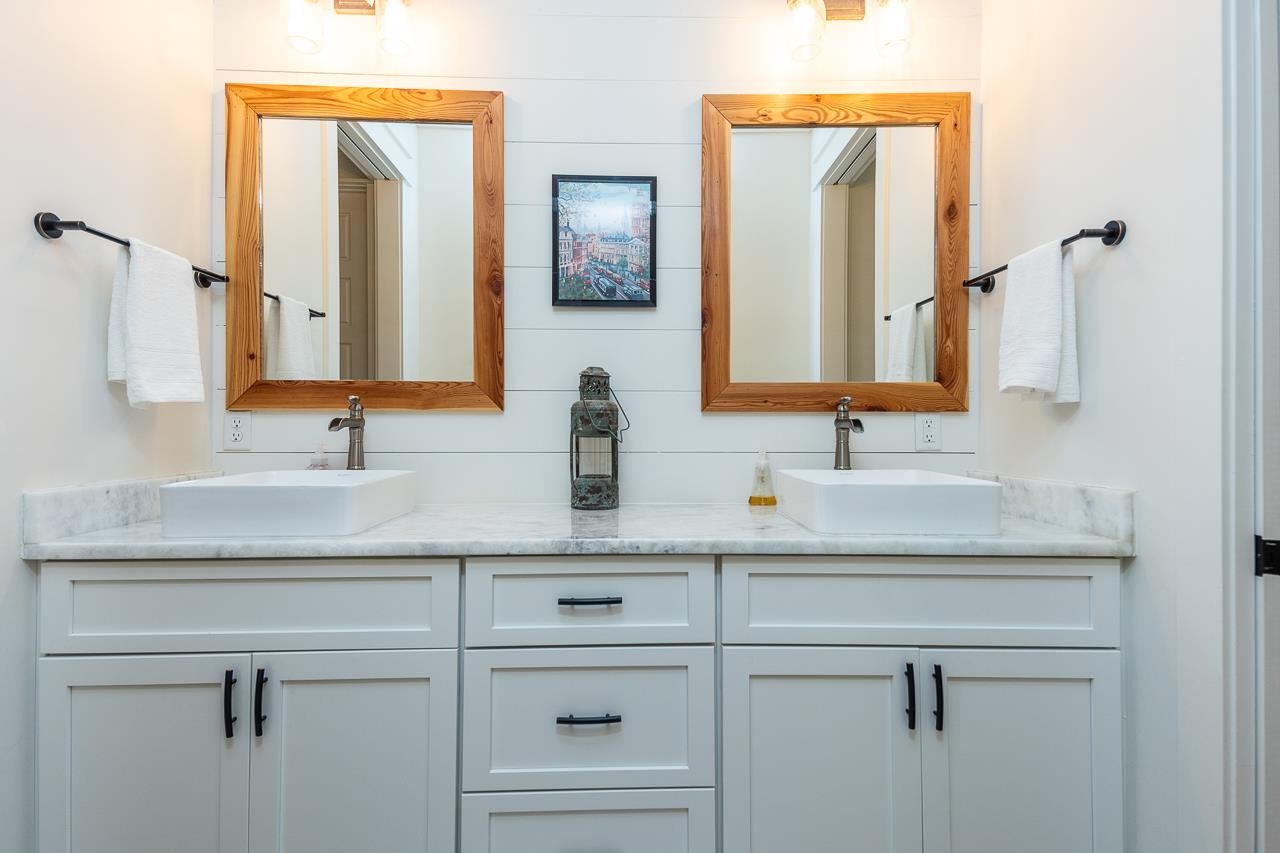570 Wildwood Road Eads, TN 38028 - Photo 17 of 38 a bathroom with a sink and a mirror
