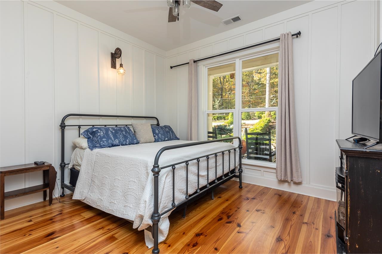 570 Wildwood Road Eads, TN 38028 - Photo 18 of 38 a bedroom with a bed and a tv