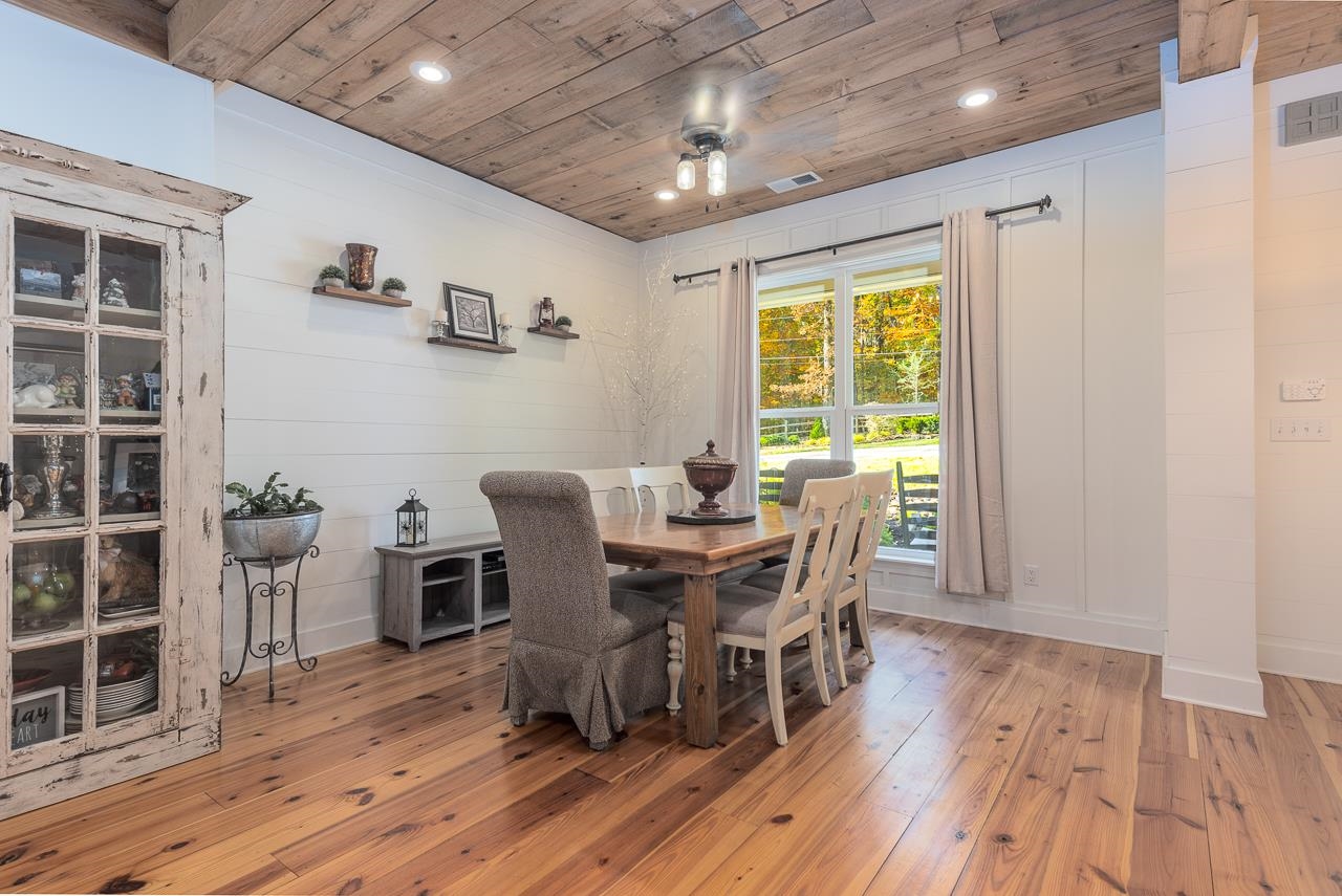 570 Wildwood Road Eads, TN 38028 - Photo 10 of 38 a view of a dining room with furniture window and wooden floor