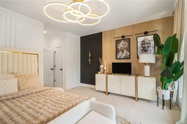 a bedroom with a bed and a large window with outer view