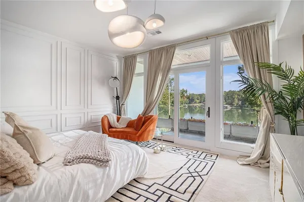 a bedroom with a large bed and a large closet