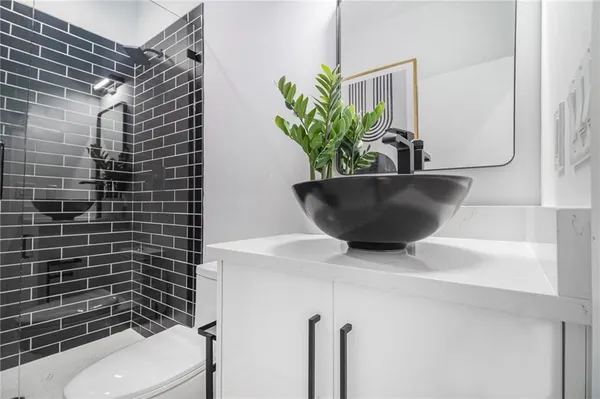 a kitchen with wooden cabinets and a window