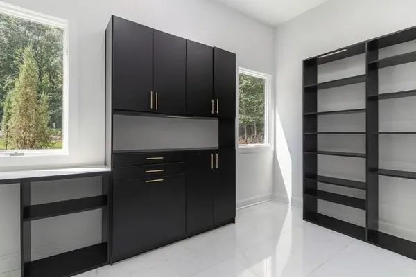a kitchen with a refrigerator and a sink