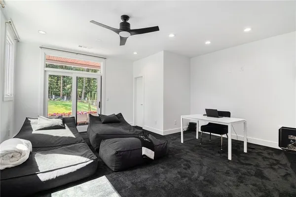 a open kitchen with stainless steel appliances granite countertop a stove a sink dishwasher and cabinets with wooden floor