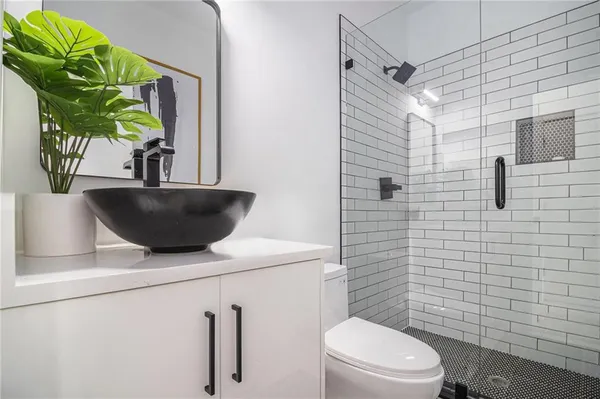 a balcony with tall trees in the background
