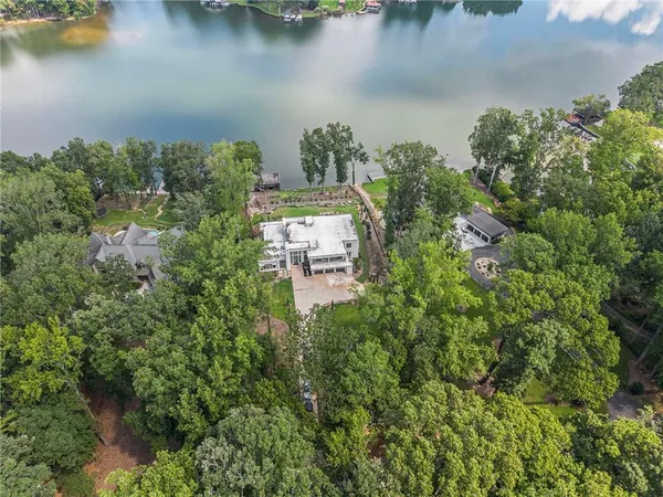 aerial view of a house with swimming pool and porch