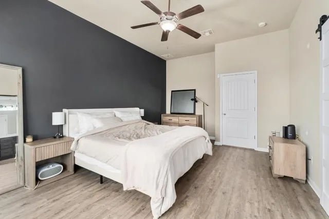 a bedroom with a bed and a dresser