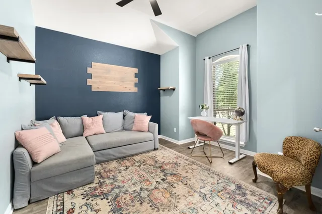 a living room with furniture and a window