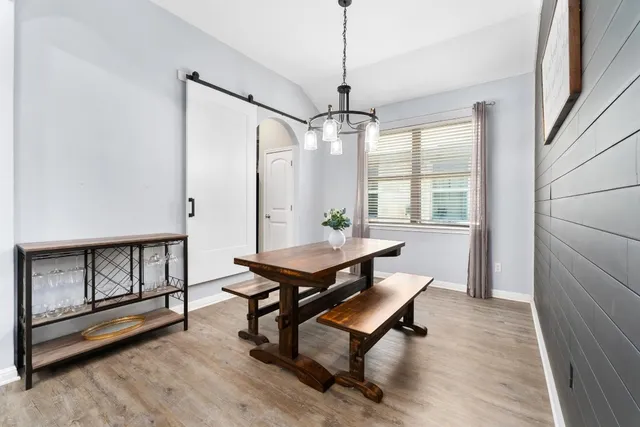a living room with furniture a window and a ceiling fan