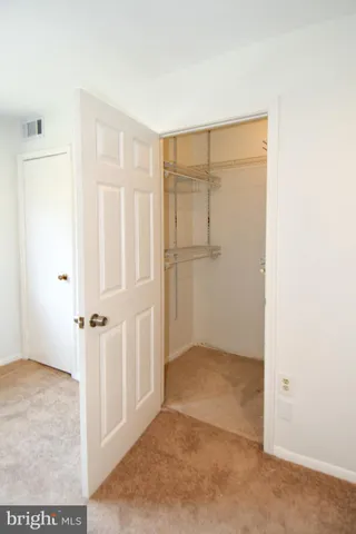 an empty room with wooden door